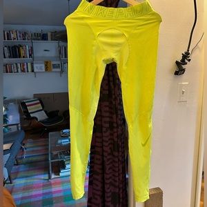 Worn Nike Pro Compression running tights in volt
